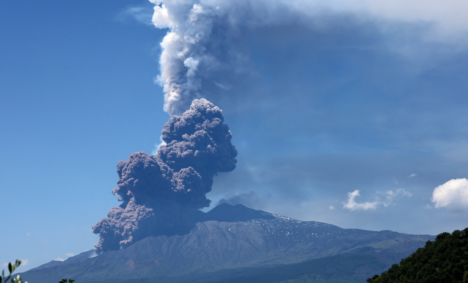 Mount Etna erupts on Italy’s national holiday, sending tourists fleeing amid lava and ash.