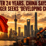Red Chinese flag waves over Shanghai skyline at sunset, with shipping containers and a crane in the foreground and a bold news headline about China no longer seeking ‘developing country’ status.