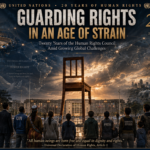 Global rights banner: "Guarding Rights in an Age of Strain" with a fallen chair at sunset, crowd of diverse people facing it, symbolizing human rights under threat.
