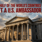 Bold red headline over a government building and US flag: 'More than half of the world's countries without a U.S. ambassador' conveying a diplomatic shortage claim