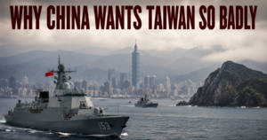 Bold headline reads 'WHY CHINA WANTS TAIWAN SO BADLY' over a naval scene with gray warships near a rocky island and a city skyline in the background, suggesting geopolitical tension.
