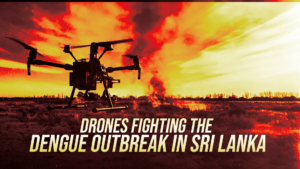 Silhouette of a multi-rotor drone in a field with a fiery red-yellow sky and large headline about drones fighting the dengue outbreak in Sri Lanka