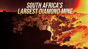 Banner stating "South Africa's Largest Diamond Mine" over a fiery orange canyon landscape.